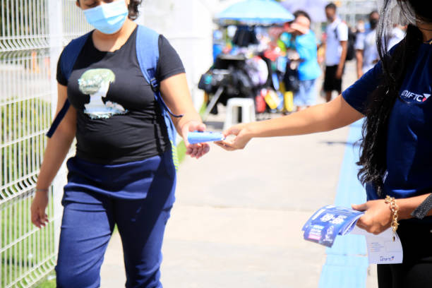 salvador, bahia, brazil - august 12, 2021: Person is seen distributing advertising flyers on the street in Salvador city.